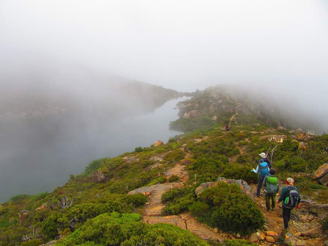 people walking in to Tarn Shelf with Tasmanian Iconic Walks