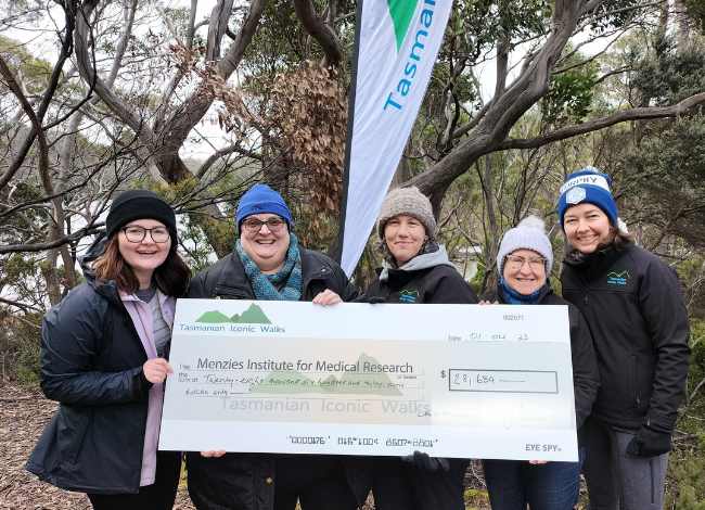 tasmanian iconic walks fundraising cheque for menzies institute for medical research 2023 event